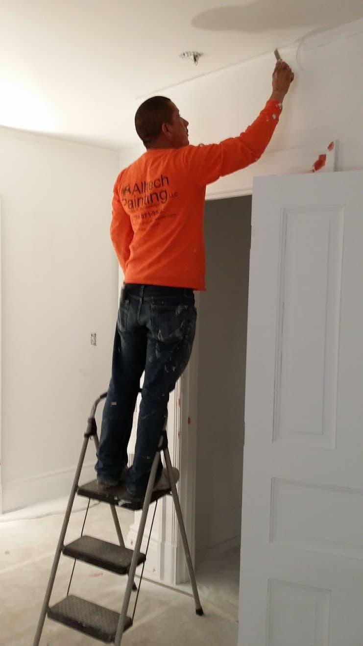 Alltech Painting crew completing detailed interior touch-up work in Renton
